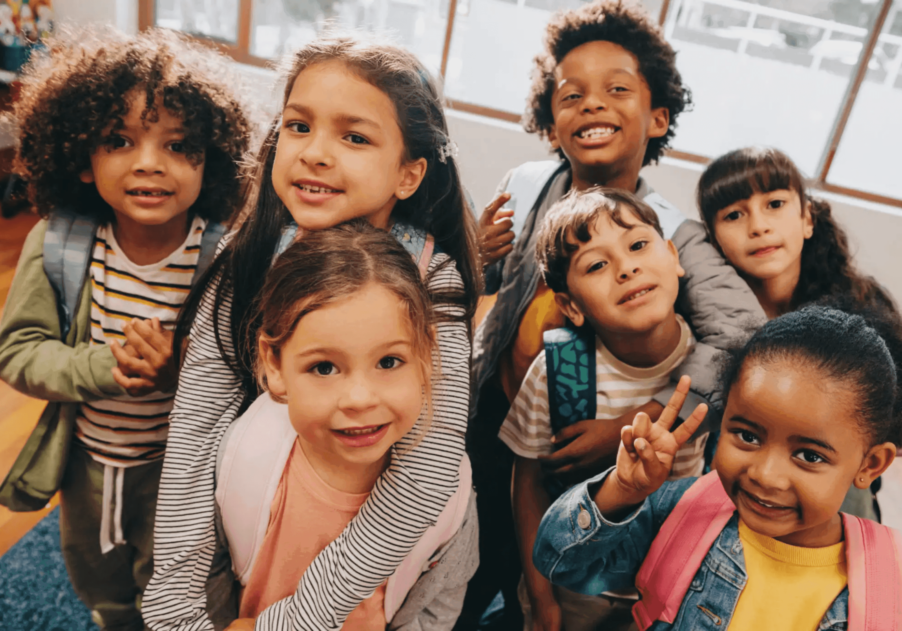 Smiling children posing together in a group.
